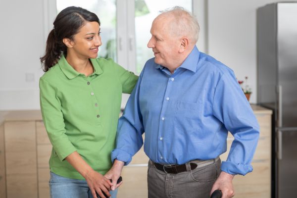 caregiver helping older man