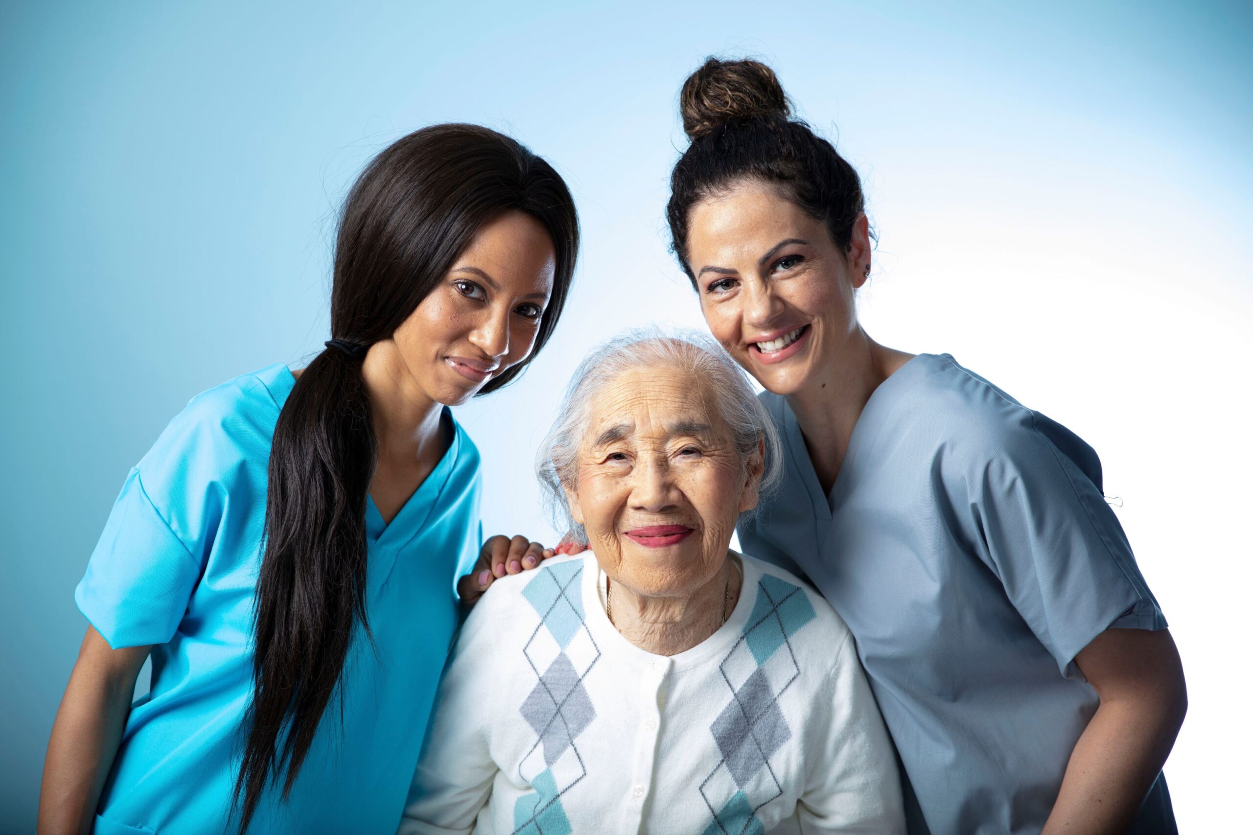 Two professional caregivers with an older woman