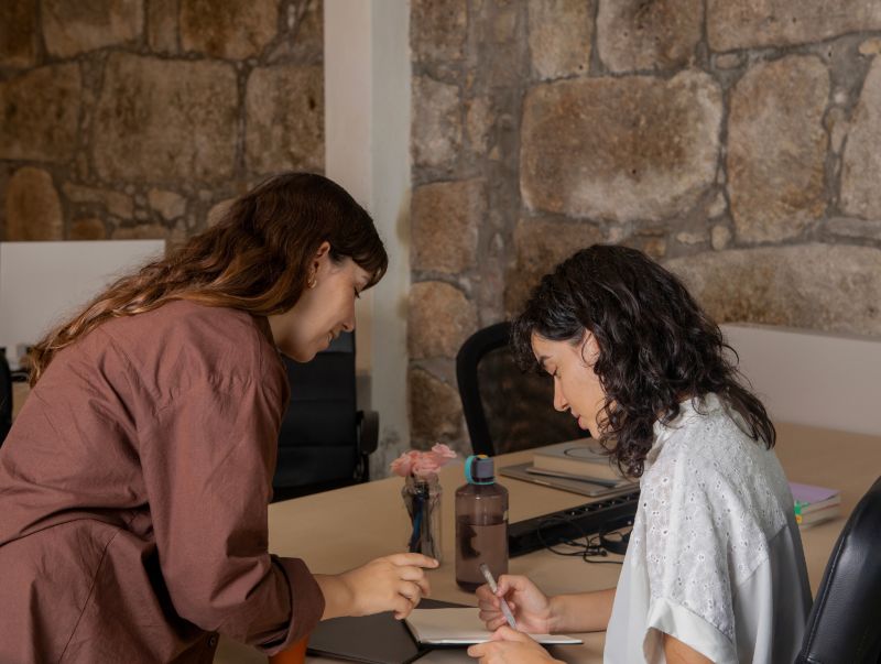 Two women in a workplace 
