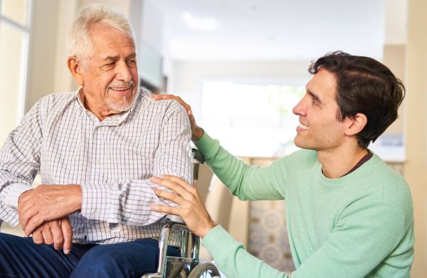 young man helping senior