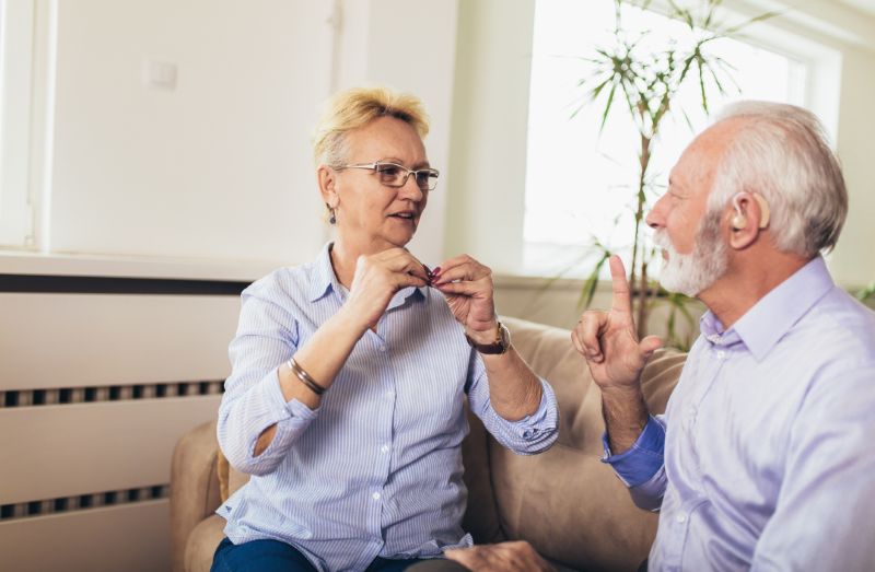 A man and women talking with sign language