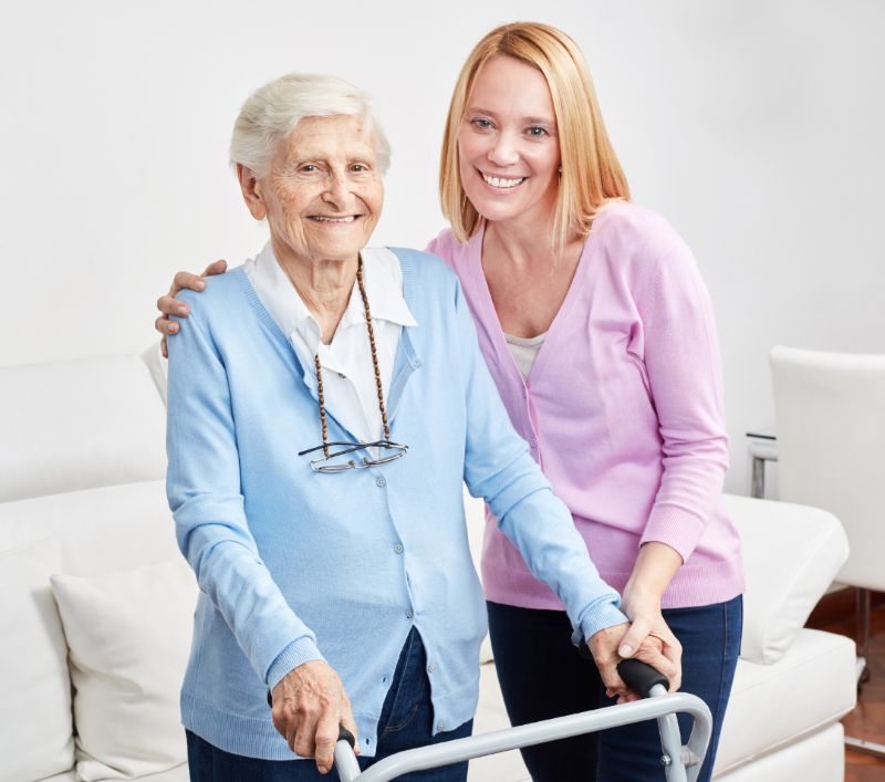 Daughter walking with senior Mother