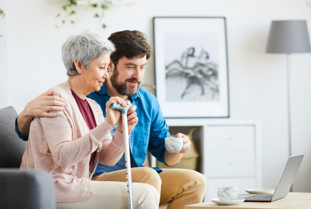 man and women looking at home services on a computer