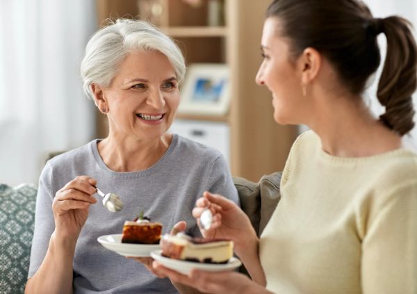 Mother and daughter eating together