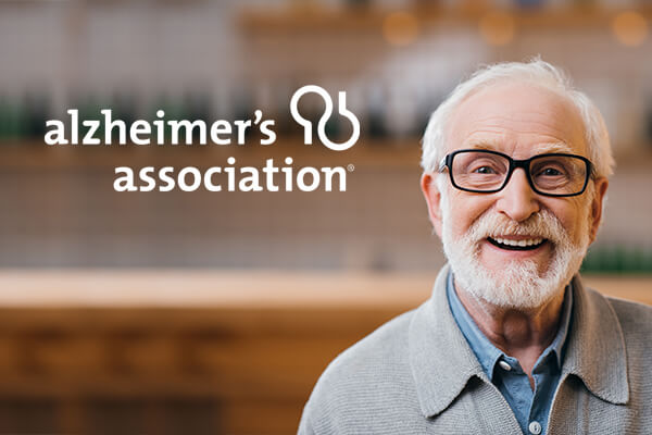 Alzheimer's Association logo with elderly man smiling