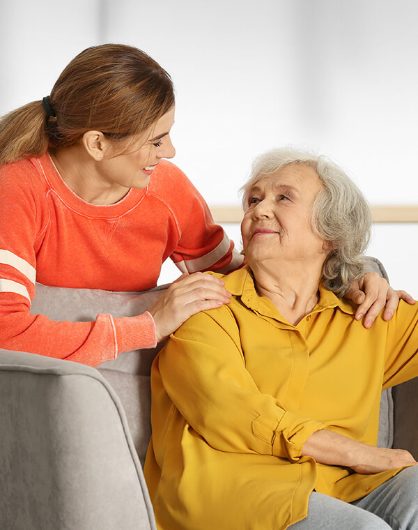 Young woman smiling with older patient