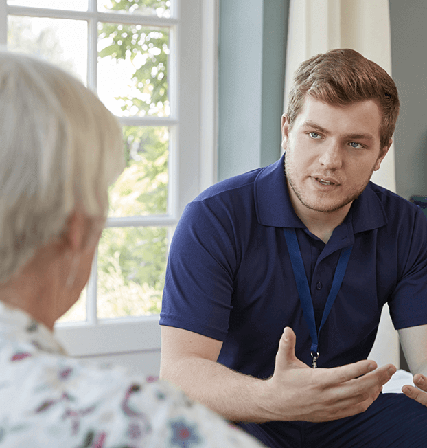 Young nurse consulting with older person