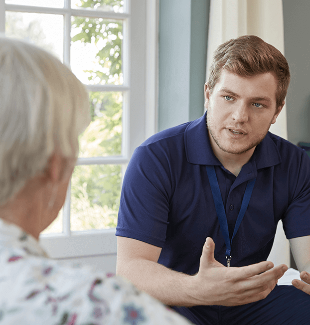 Home nurse going over charts with older man