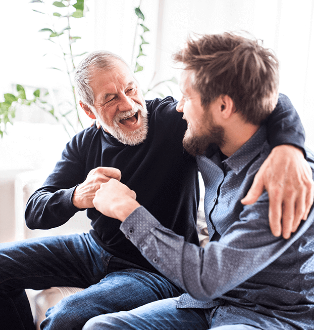 Home nurse fist-bumping older man