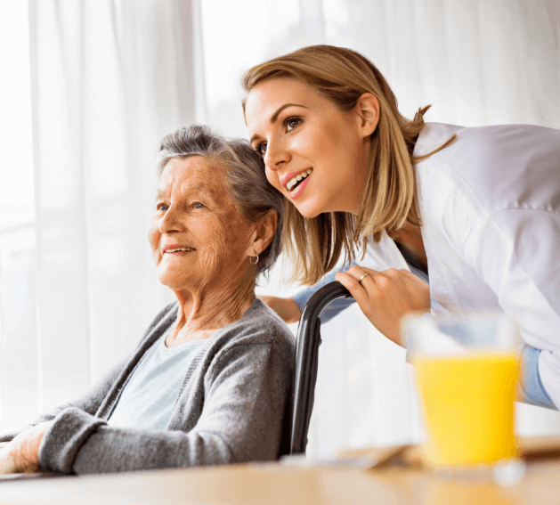 Young nurse looking off screen with older woman