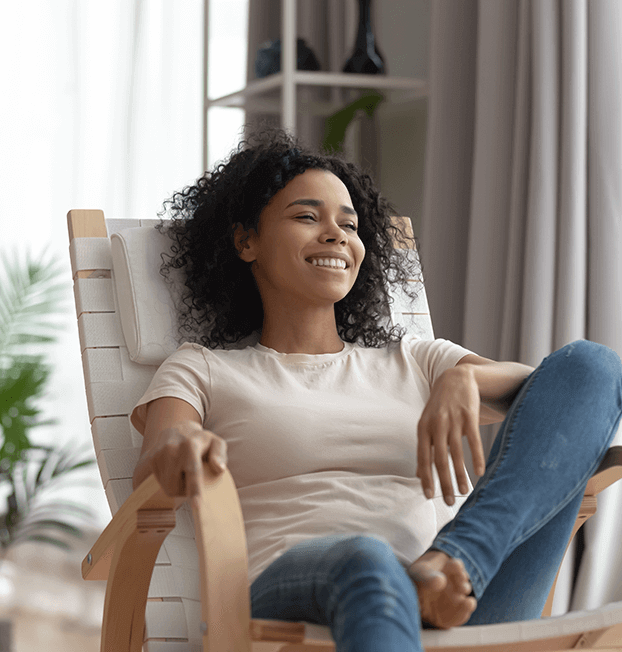 Home nurse relaxing on chair