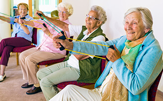 Older women exercising with equipment