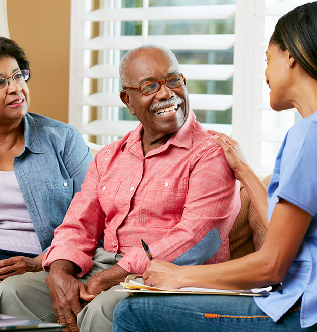 Young nurse consulting with older man