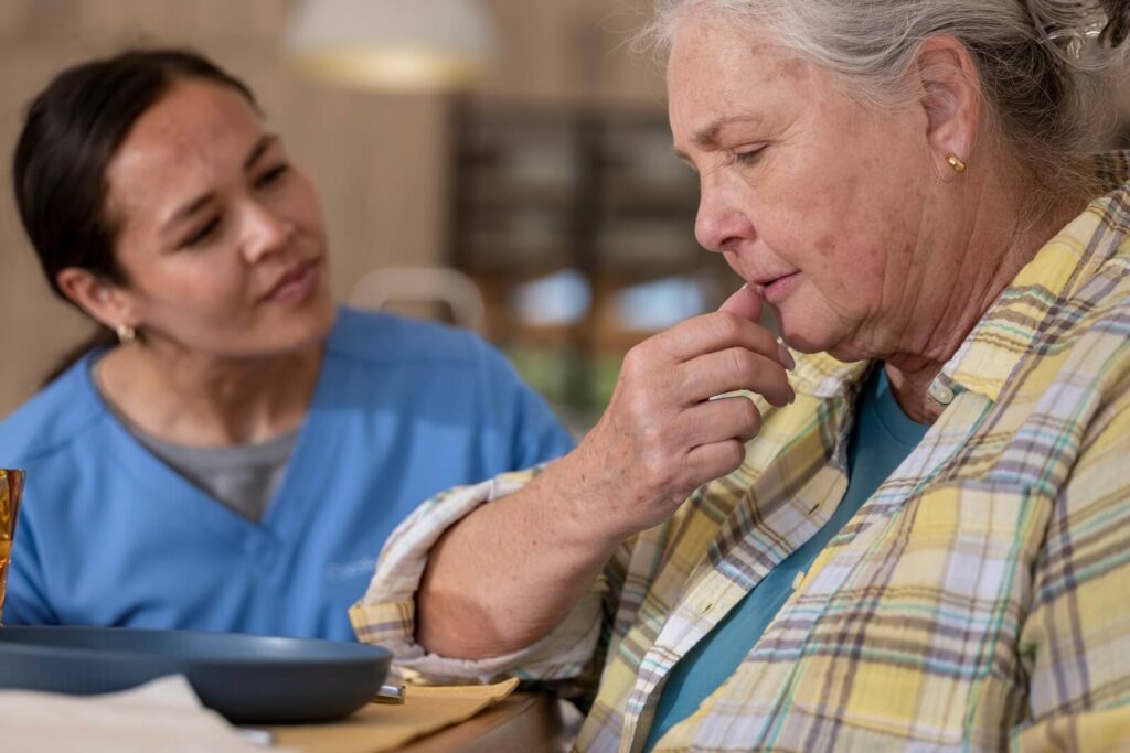 Caregiver providing compassionate memory loss support for a senior