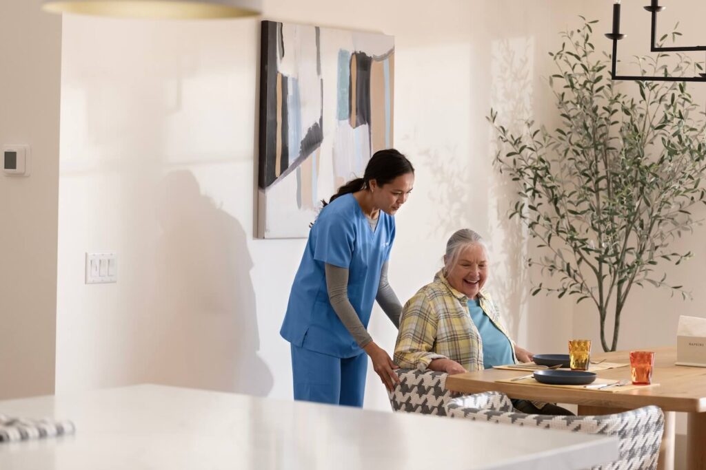ComForCare Caregiver Helping Patient
