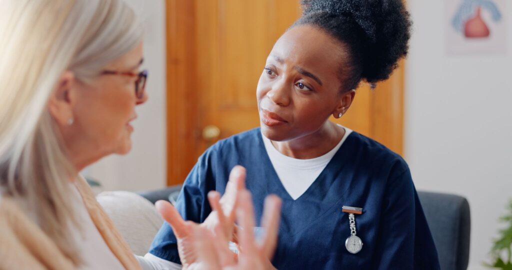A family caregiver in San Antonio talking with a home care professional about respite support.