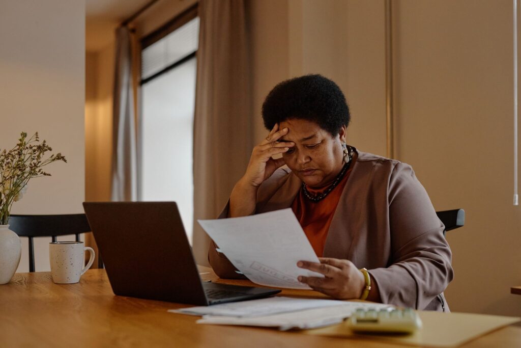 A family caregiver reviewing caregiver burnout signs and considering respite care options at home in New Braunfels.